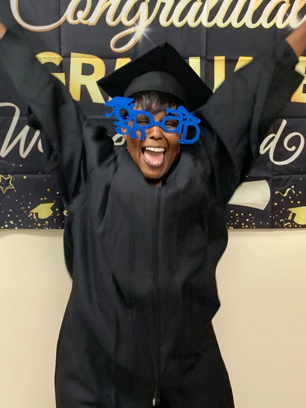 graduate showing excitement about completing the program